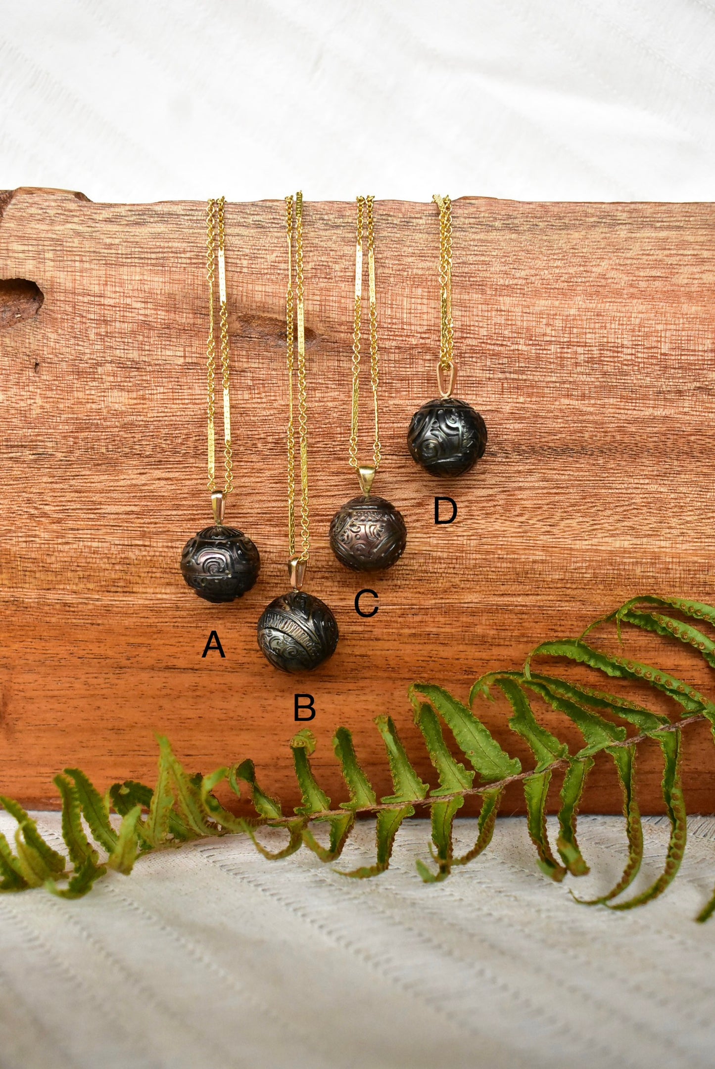 Carved Tahitian pearl pendant