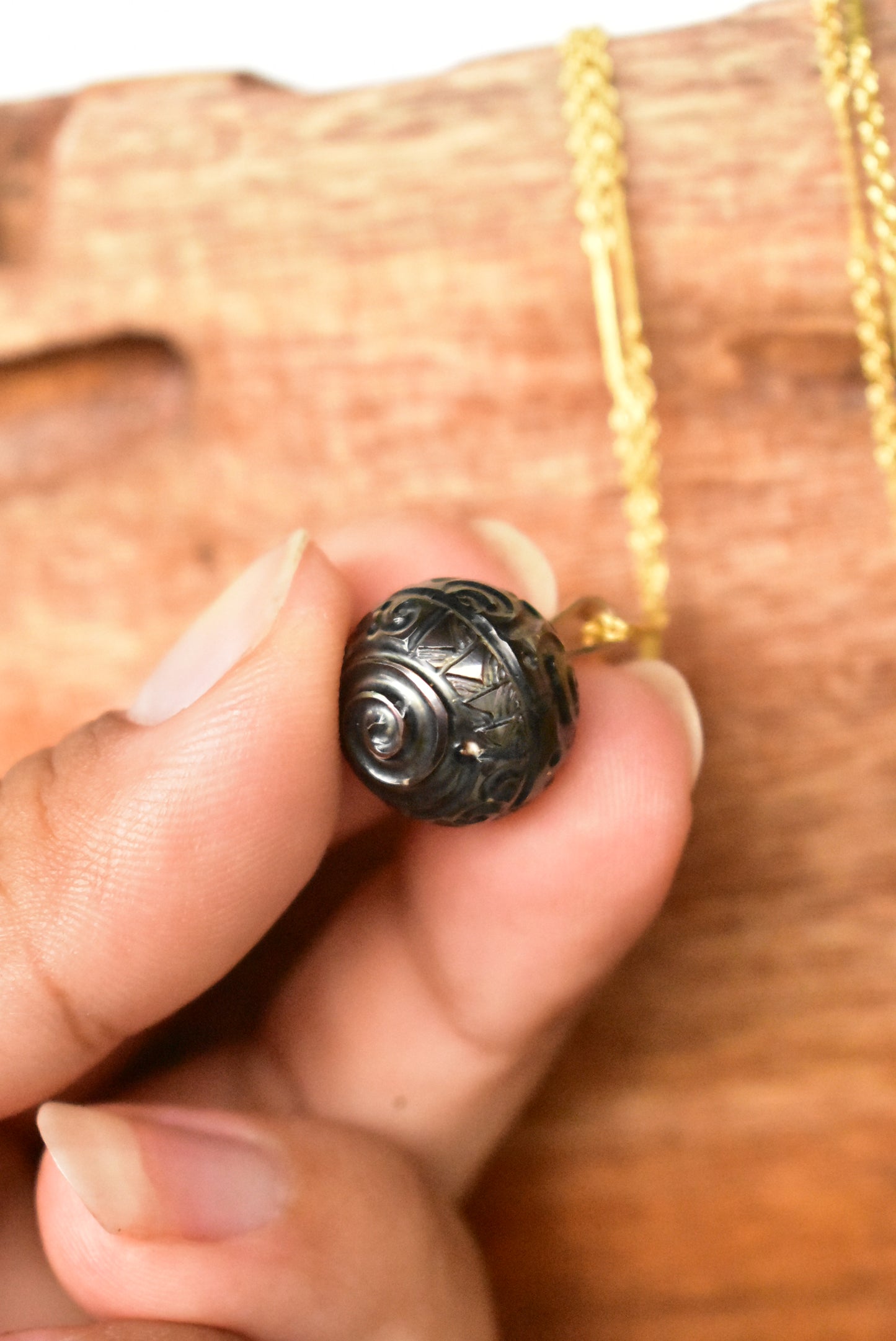 Carved Tahitian pearl pendant