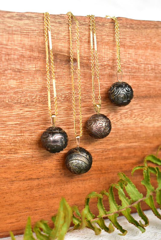 Carved Tahitian pearl pendant