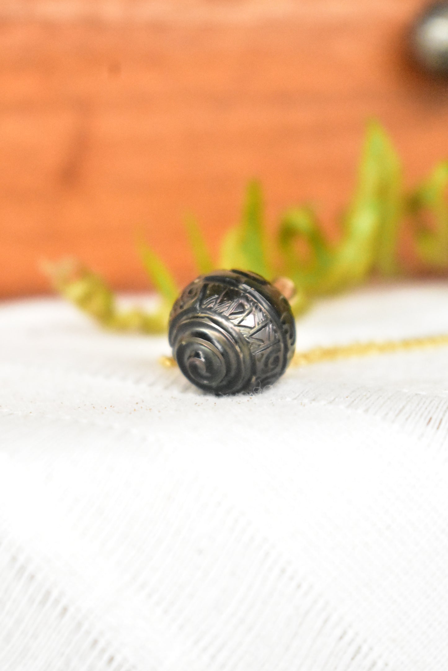 Carved Tahitian pearl pendant