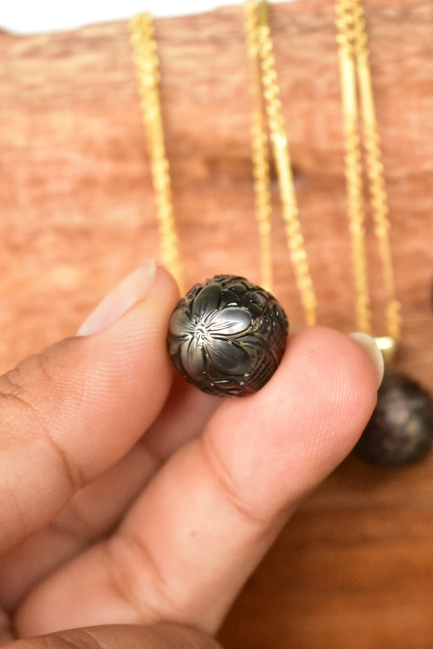 Carved Tahitian pearl pendant