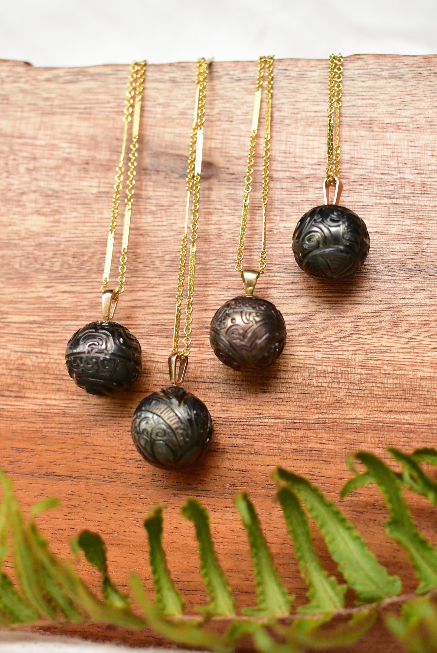 Carved Tahitian pearl pendant