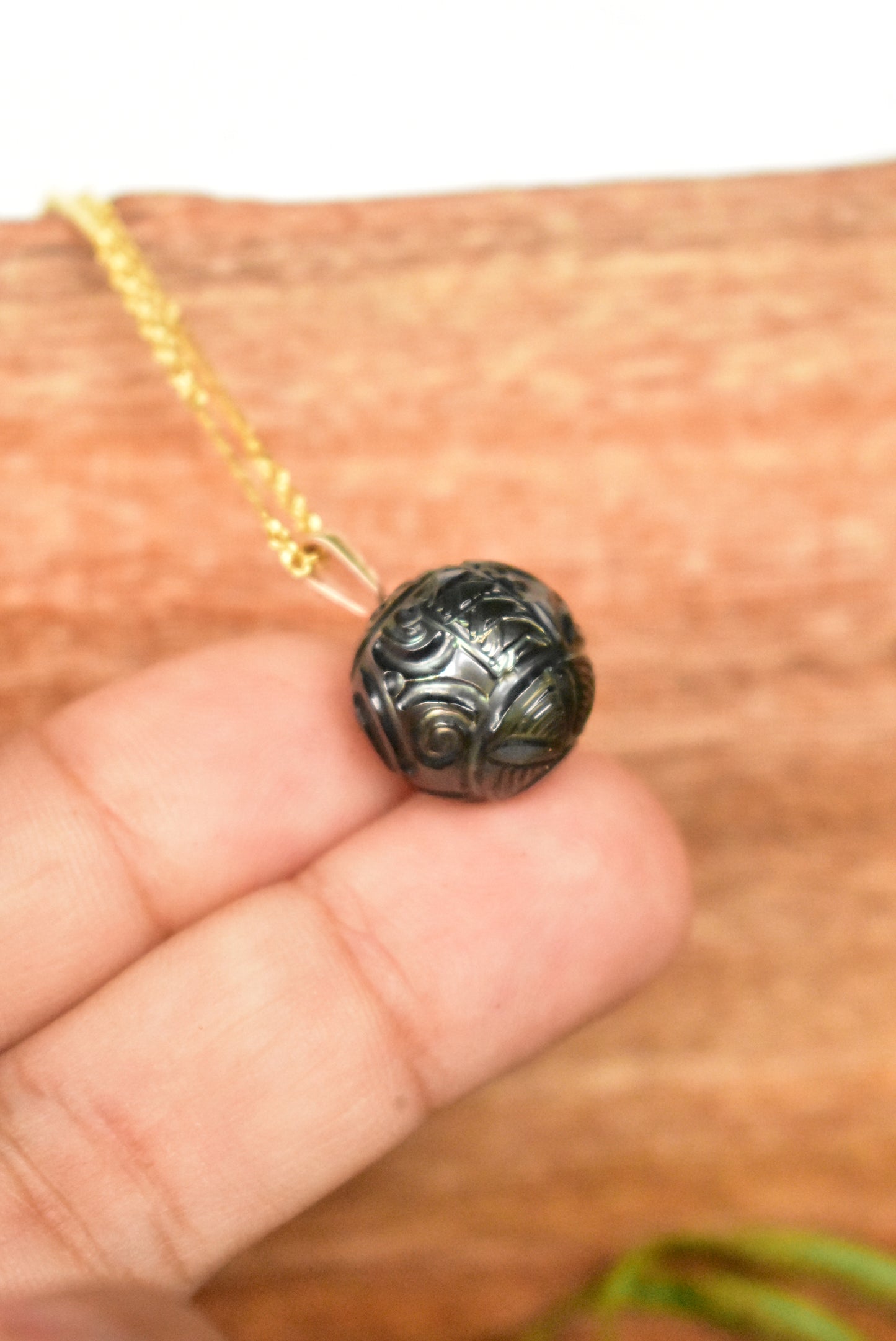Carved Tahitian pearl pendant