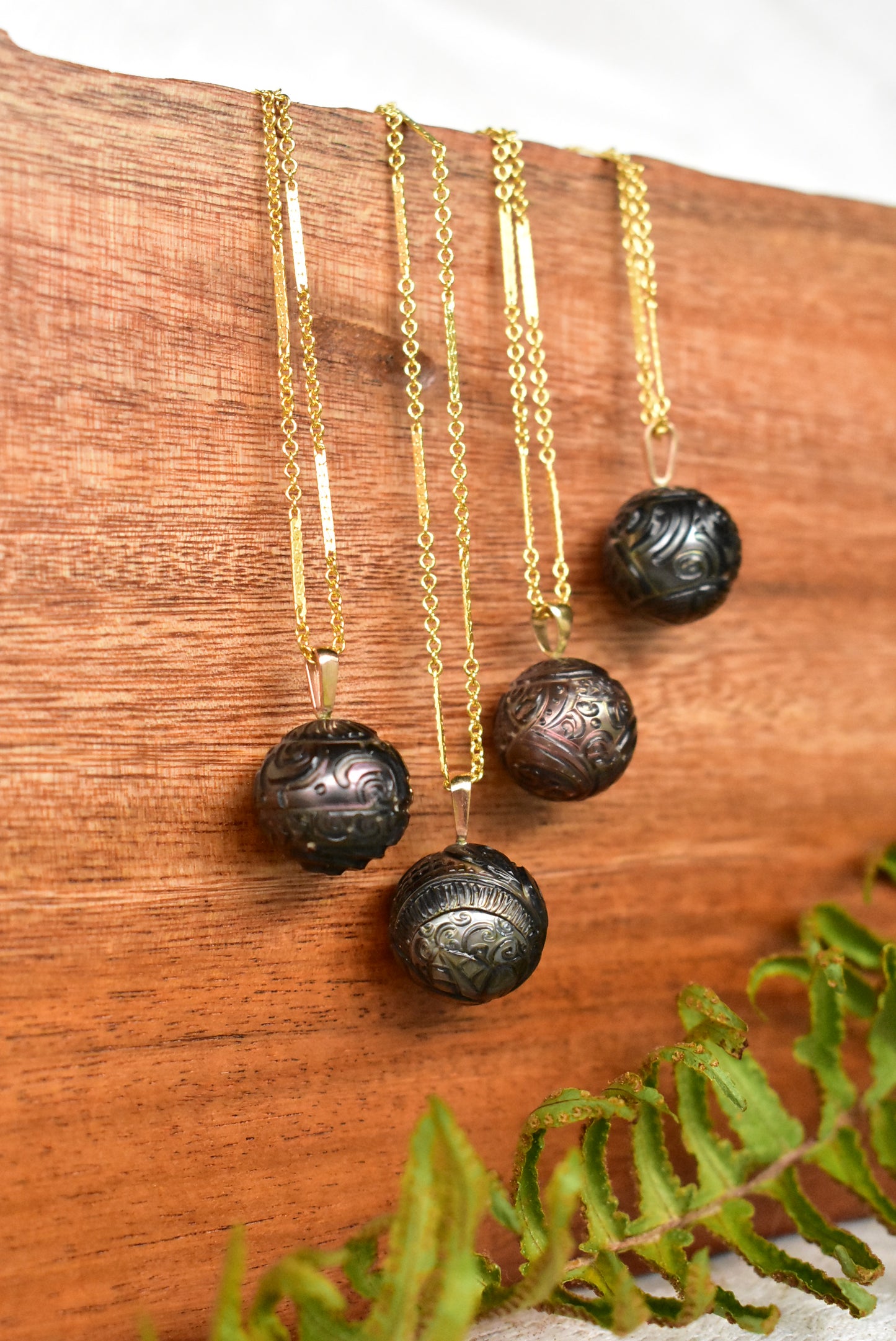 Carved Tahitian pearl pendant
