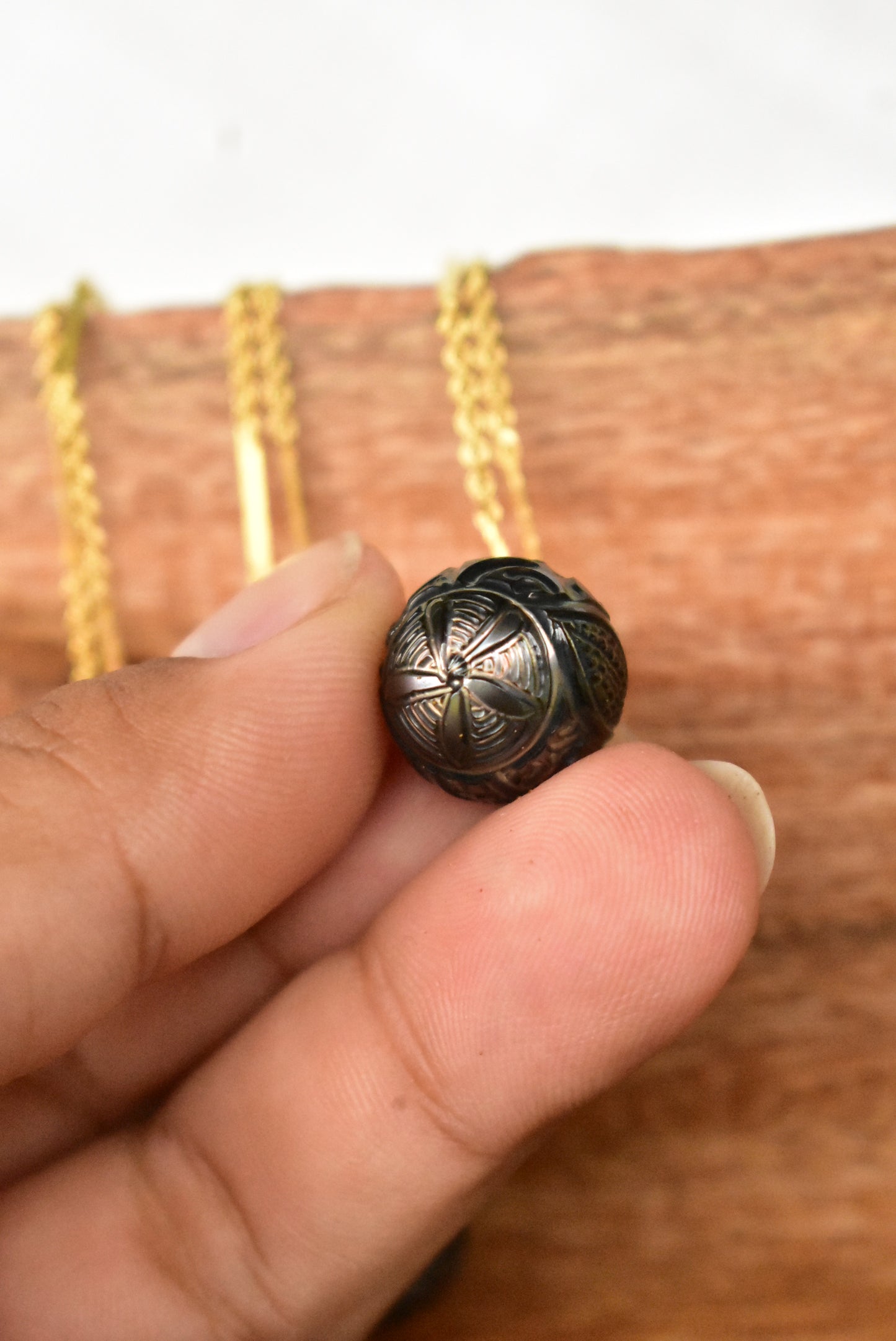 Carved Tahitian pearl pendant